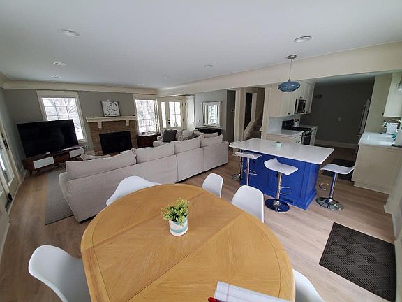 View of living, kitchen and dining area.