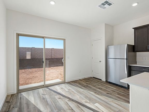 The beautiful kitchens opens up to the back patio through sliding glass doors.
