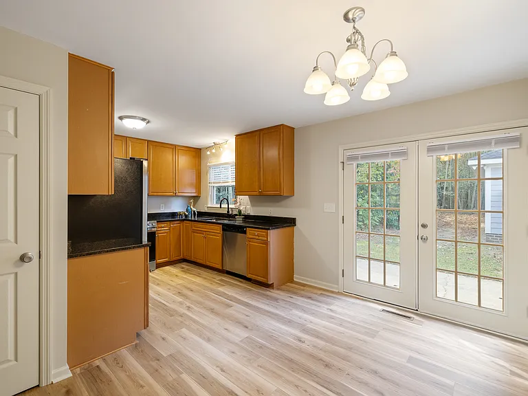 Dinette/kitchen area; panty door on left; french doors out to backyard