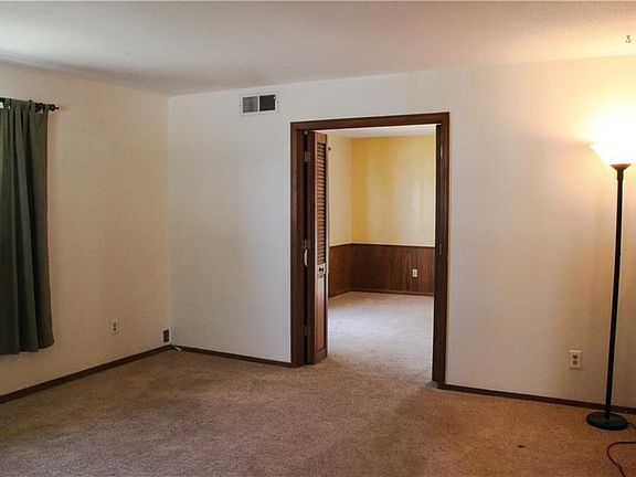Living room looking into the large dining room.