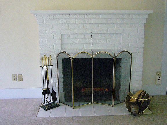Original wood fireplace.