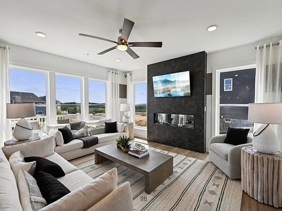 Gathering Room with an Optional Fireplace Surrounded by Designer Tile