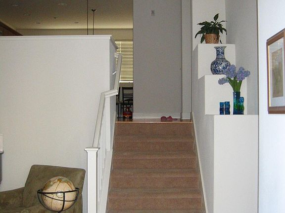 stairs leading up to dining, kitchen, and family room