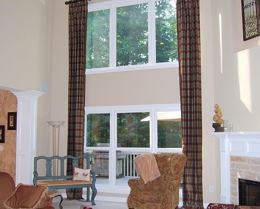 Soaring two-story Great Room with woodburning fireplace with stone surround!