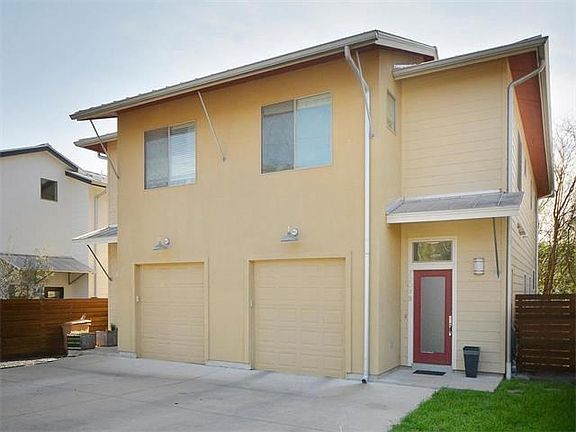Two unit building with one car garage plus large storage are