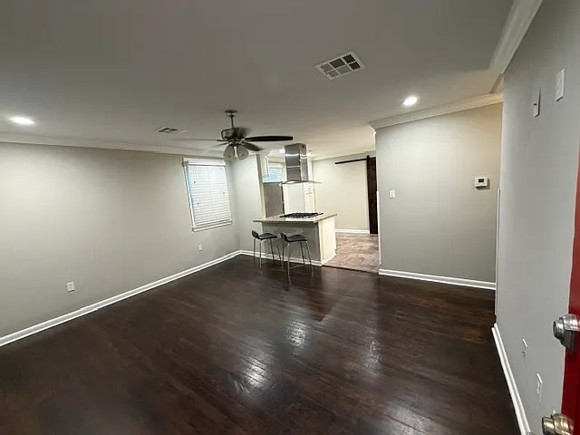 Living room and bedrooms have "real" hardwood floors. All rooms have multiple windows allowing for lots of natural light. New windows just installed.
