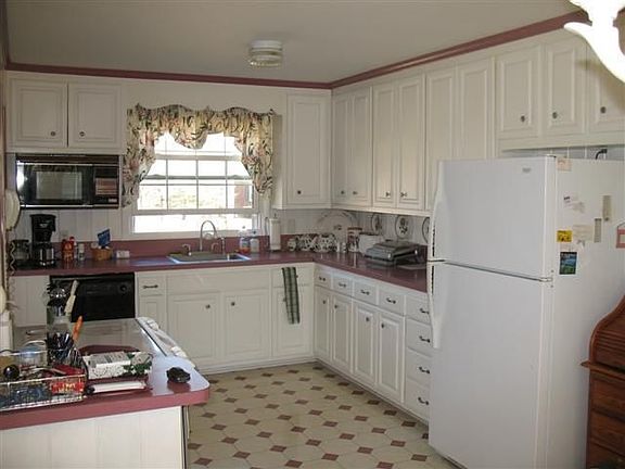 The spacious kitchen offers tons of counter & cabinet space.