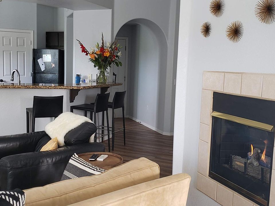 Living area looking back to the kitchen and entryway.