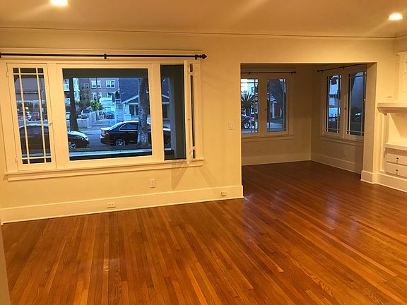 Character filled living room with access to private porch