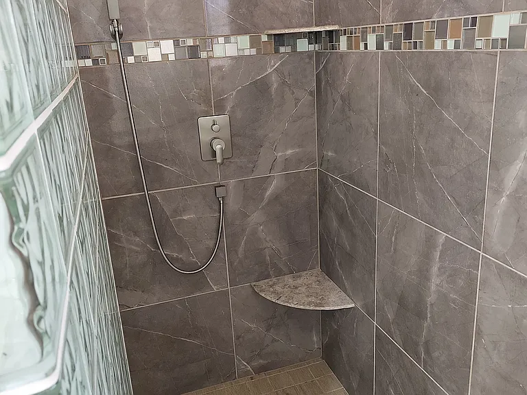 Master bedroom: walking shower with rainforest shower