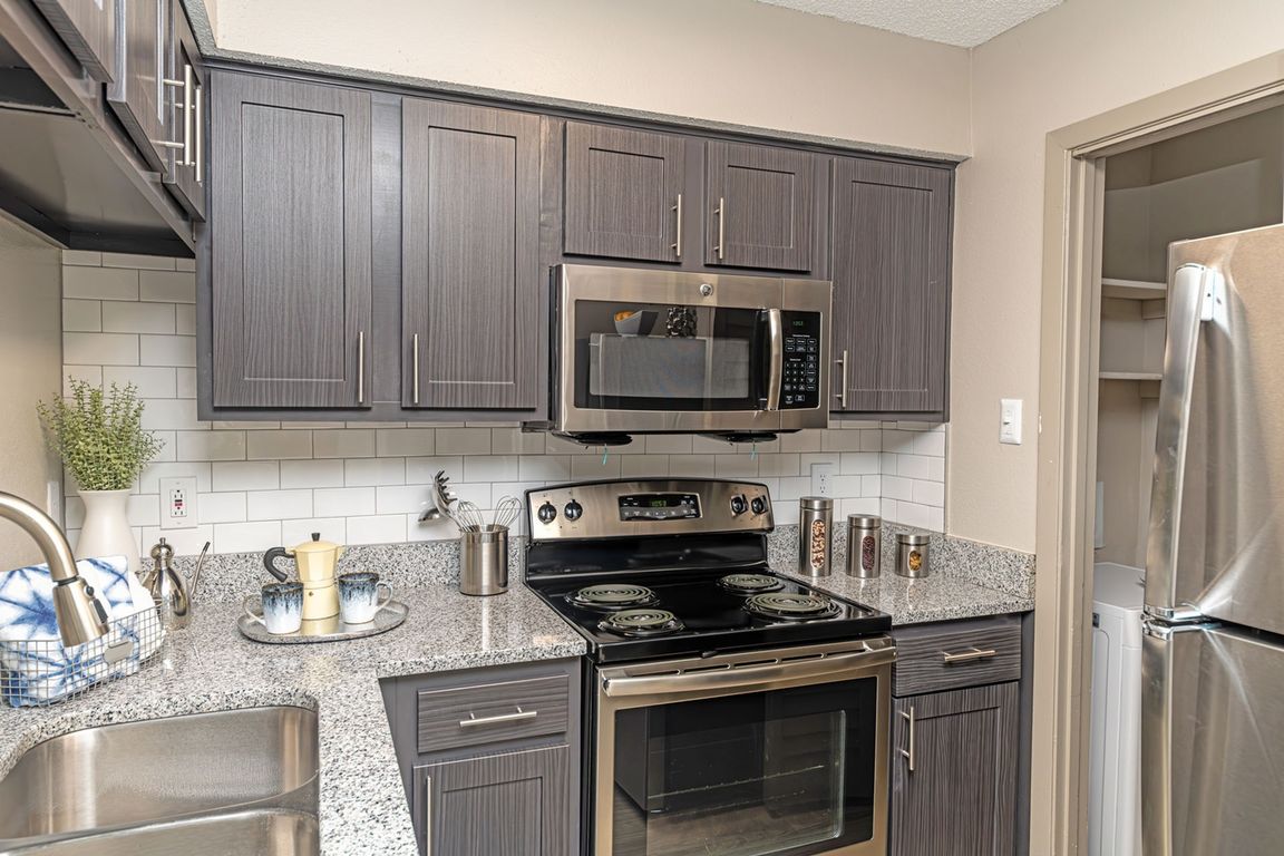 Kitchen with granite counters and modern cabinetry