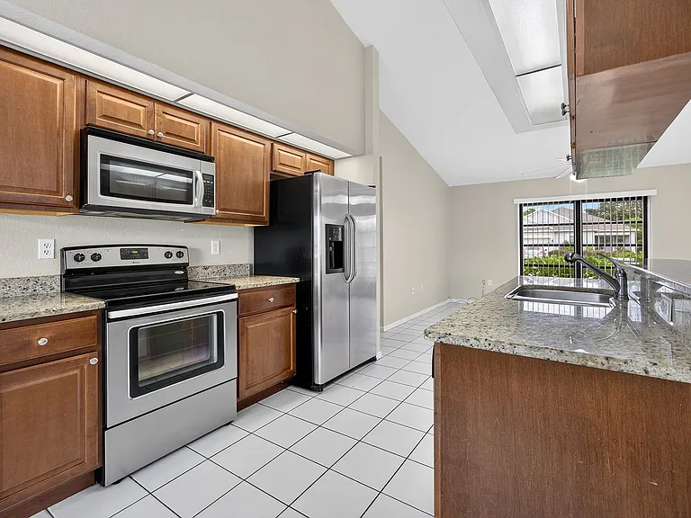 Kitchen with stainless steel appliances and granite counters.