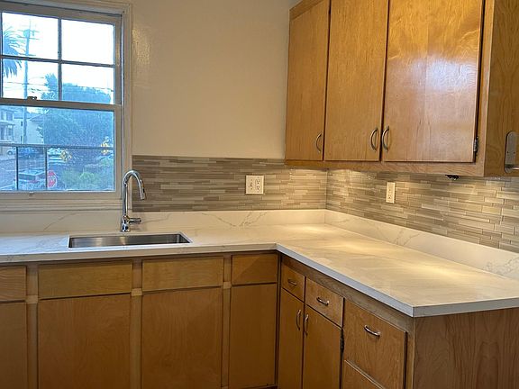 Large East facing window in kitchen brings in lots of morning sunlight