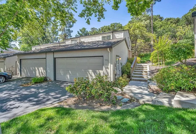 Front of the house - only 1 shared wall with quiet neighbors, large two-car garage and ample off street parking for guests in designated areas