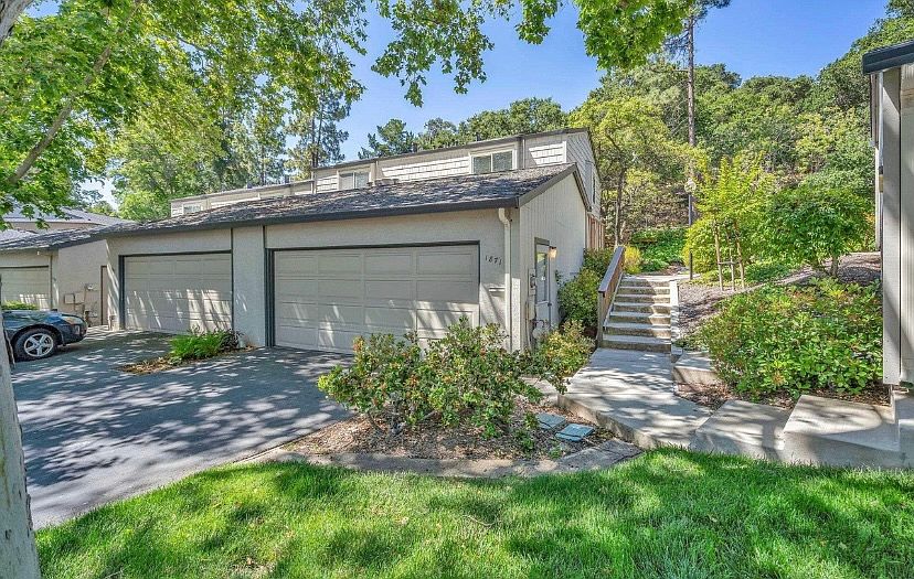 Front of the house - only 1 shared wall with quiet neighbors, large two-car garage and ample off street parking for guests in designated areas