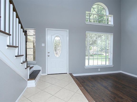 Another view of formal dining room and foyer.