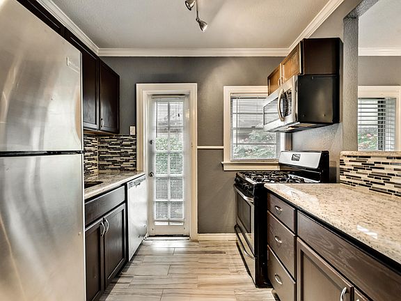 Renovated Kitchen with Granite Countertops and SS appliances