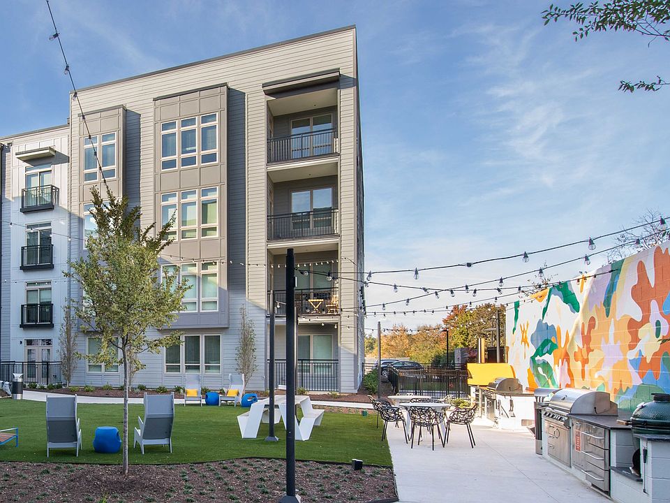 Outdoor Lounge and Grilling Station at UHill Apartments in Durham, NC