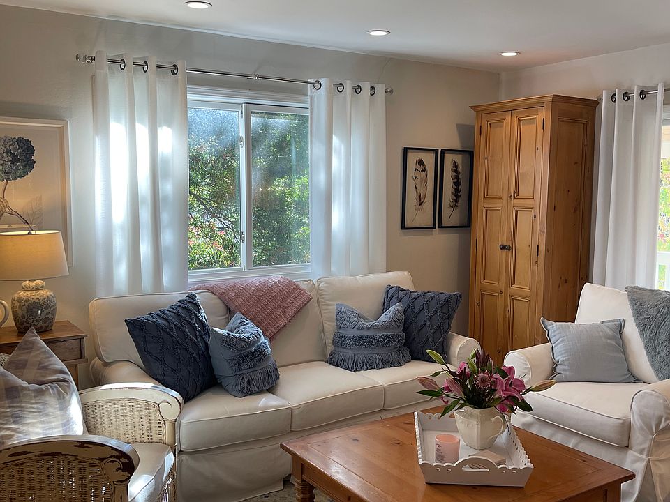 Living Room with sliding doors that lead to lovely front porch