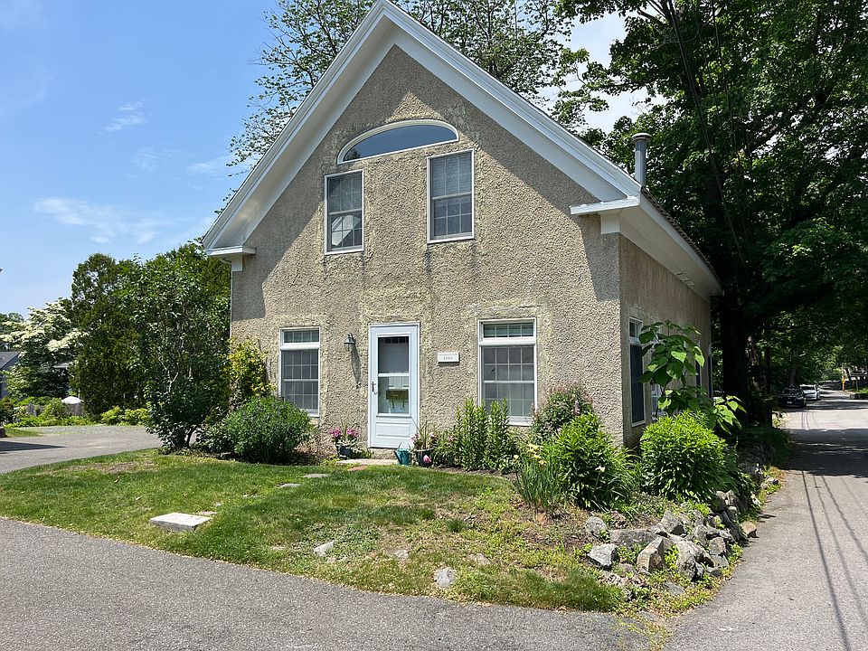 2 Bedroom, 2 Bath, Coastal Carriage House with dedicated driveway for two cars.