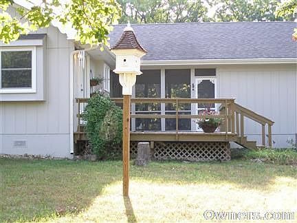 Main house, west deck and screened in porch