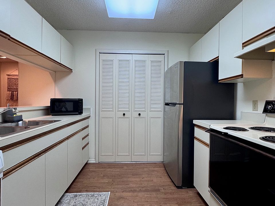 Kitchen w/ pantry & stainless steel fridge
