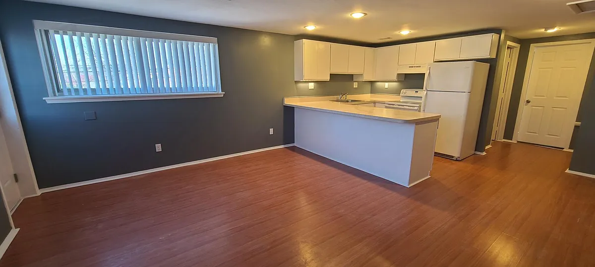 Living area, looking toward kitchen. - 36024 Division Rd #2A
