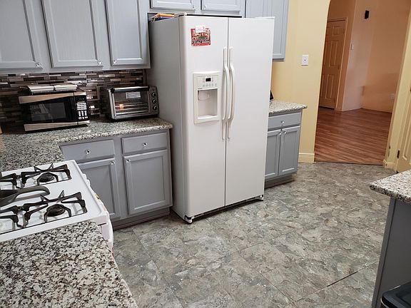 Updated kitchen, with gas stove, and plenty of cabinets for storage.