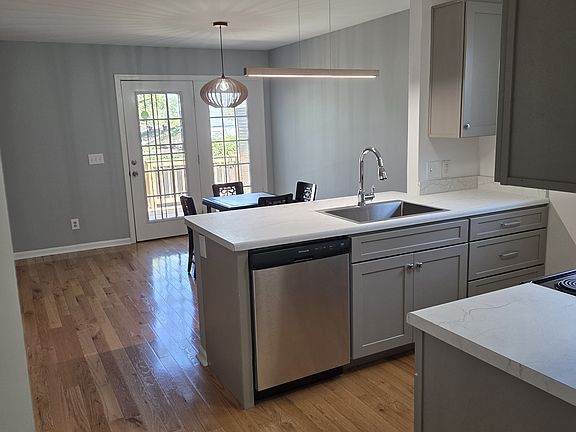 View from hallway to kitchen and dining room