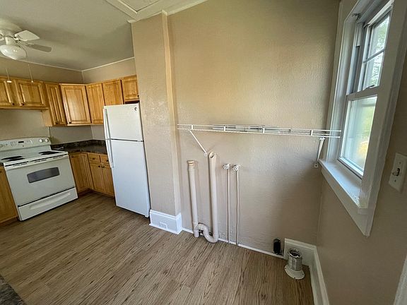 Washer/dryer hookup and half of the kitchen