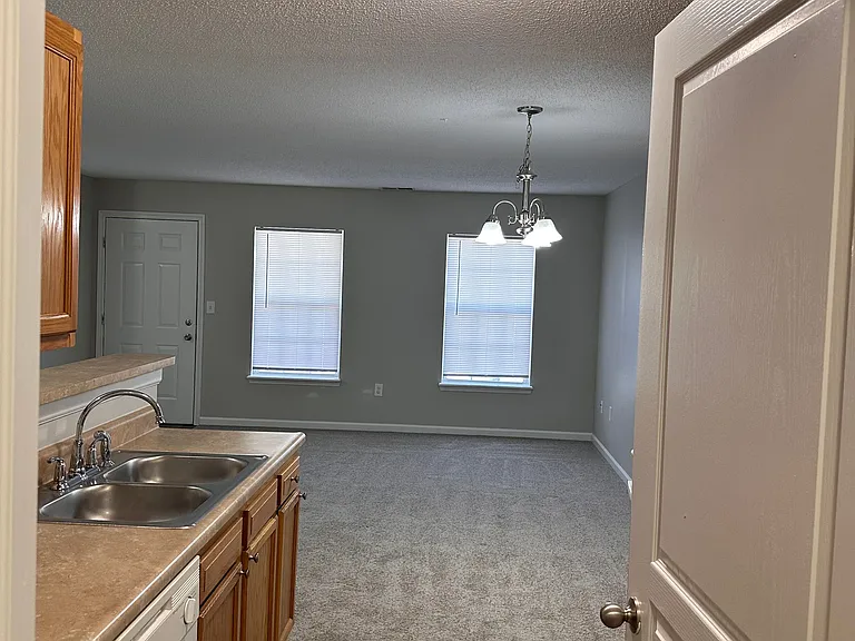 Upstairs 1 Bedroom - Looking out in the Kitchen from Laundry room