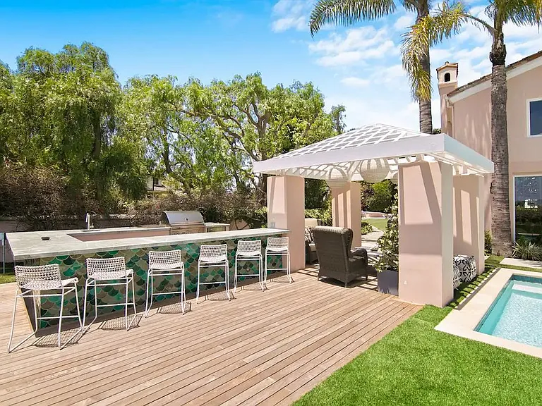 Outdoor living featuring a modern grill and plenty of room to gather and enjoy.