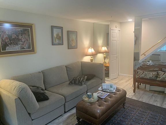 Livi9ng room from door stair up in back