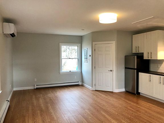 Looking towards back of apt - bathroom door on right in corner.
