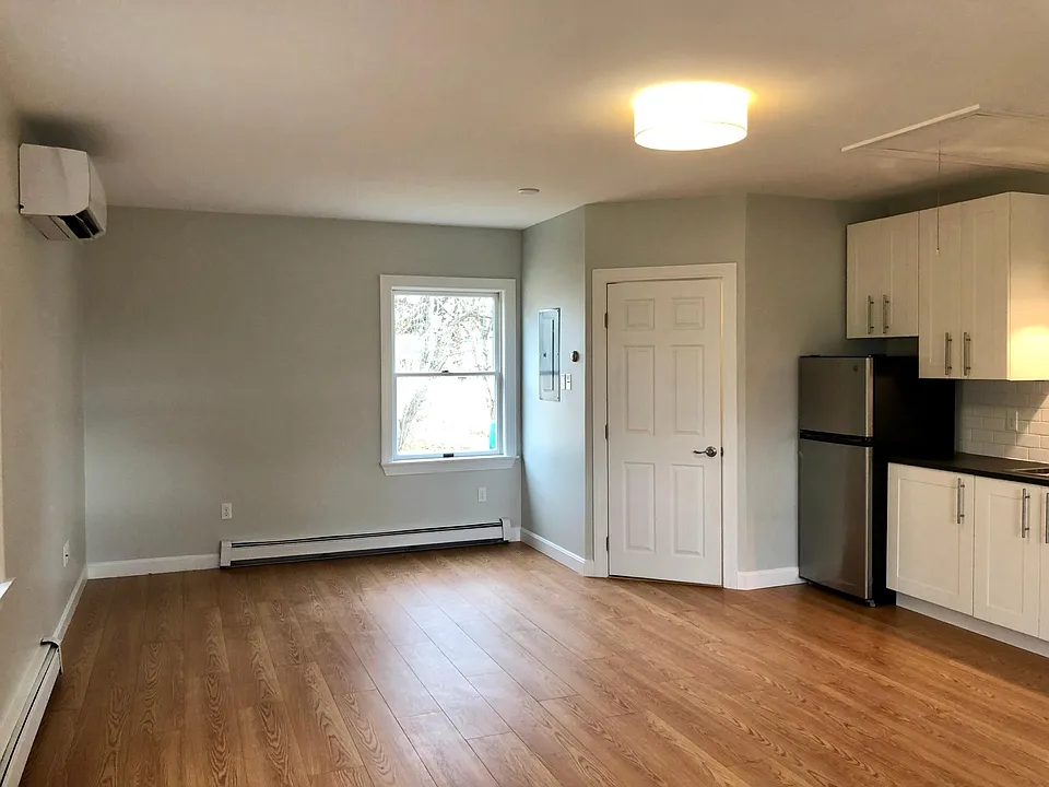Looking towards back of apt - bathroom door on right in corner.