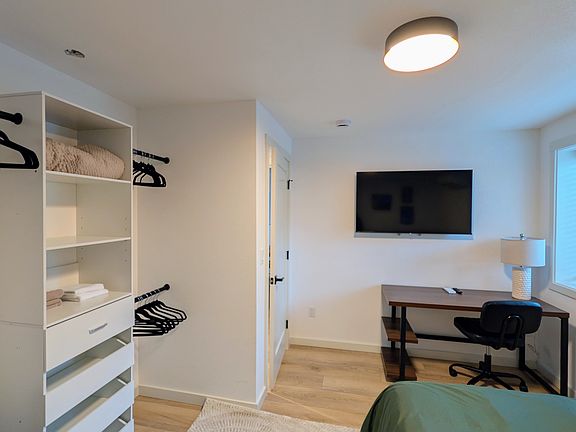 Dedicated workspace with a smart TV. Room is heated/cooled with a remote thermostat.