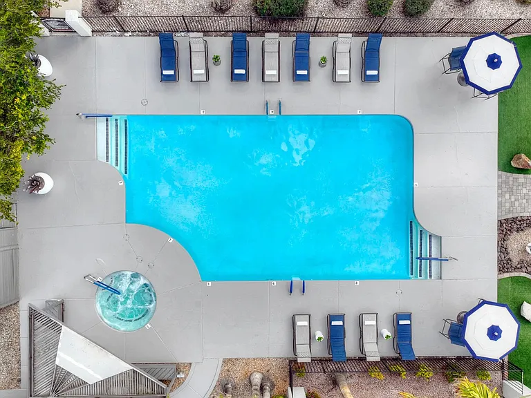 Take in the breathtaking aerial view of our expansive sun deck with glamorous, resort-style pool and spa.