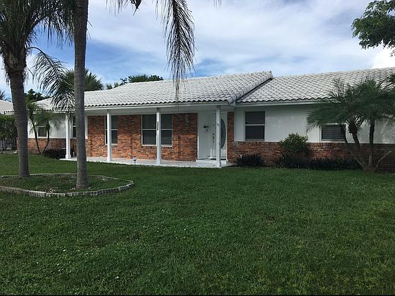 Front of House with Covered Patio
