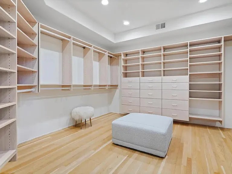 A spacious walk-in closet tailored to your storage needs.