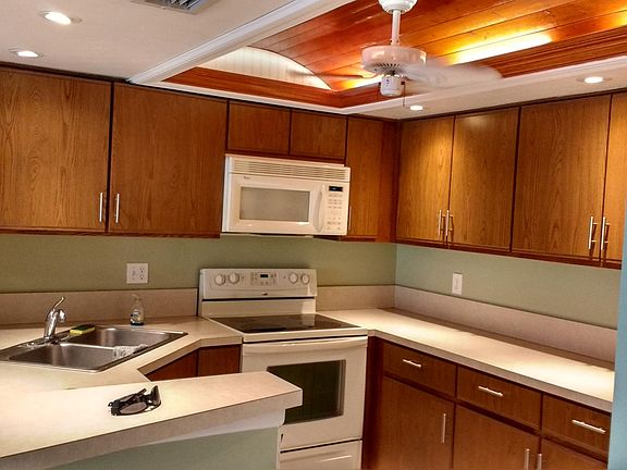 Double door refrigerator with ice maker, glass top stove/range and dish washer included