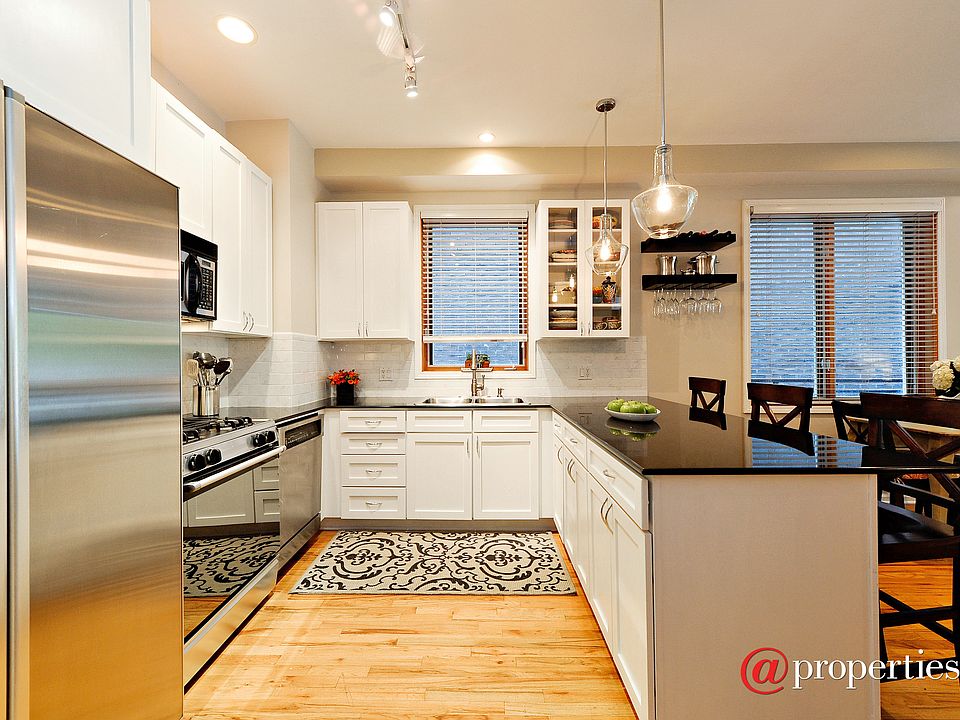 Kitchen has Stainless Apps & White Subway Tile