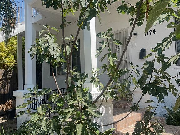 Front yard view from outdoor table looking towards home