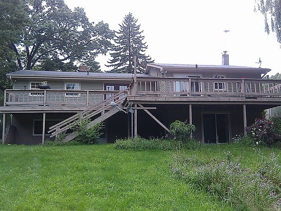 Back of the house, deck runs the expanse of the house
