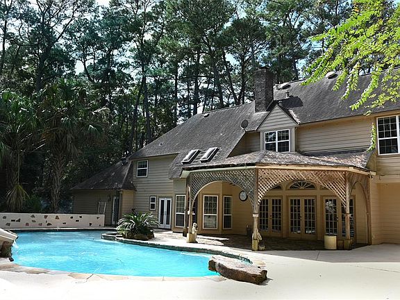 Large covered patio just off the formal living area and easy access from the pool to the half bath
