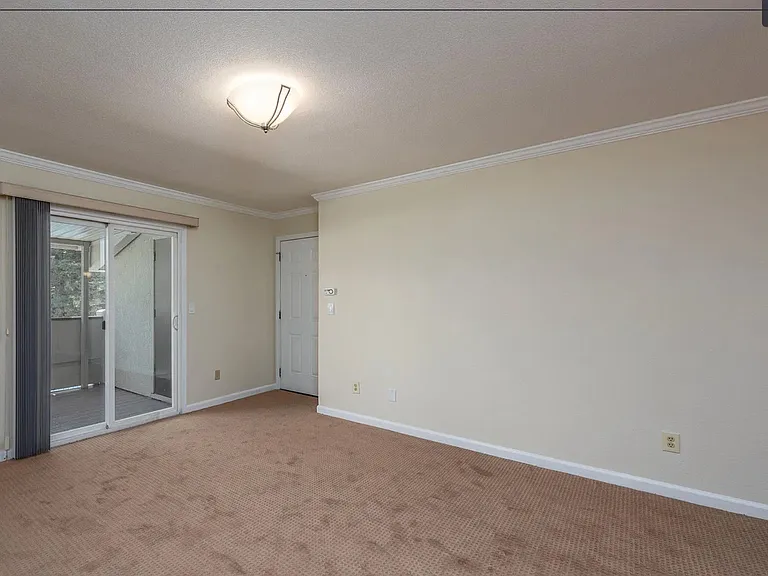 Main room with entrance and entrance to the patio.