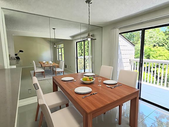 Dining room with sliding door to balcony.