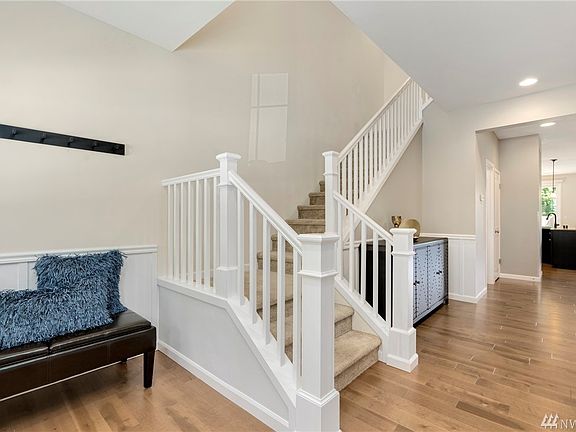 Inviting entry with new Aacer 5 inch planked Lakeshore hardwood floors on most of the main floor
