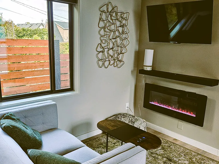 Lounging area with fireplace and smart TV