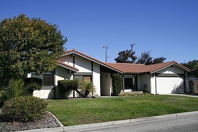 Nice yard compliments Spanish styling