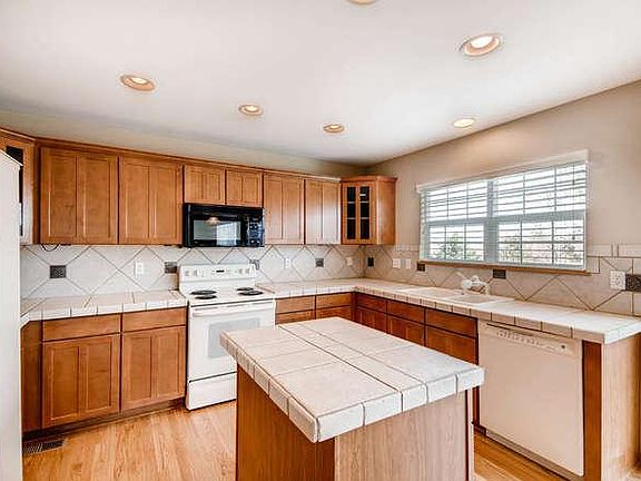 Kitchen includes appliances (dishwasher, microwave, oven/ran